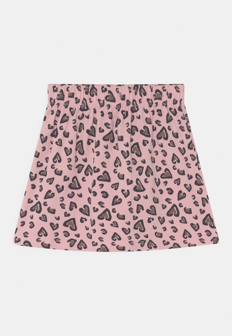 Jupe rose avec taille élastique présentant un motif léopard noir et marron sur un fond clair.