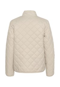 Veste matelassée beige clair avec col montant, présentant un cousu en losange et des manches longues. Texture douce, idéale pour un look décontracté.