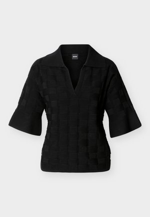 Μαύρο πλεκτό πόλο πουκάμισο με φαρδιά μισά μανίκια και υφή με τετράγωνο μοτίβο, διαθέτει βαθύ V-λαιμόκοψη και γιακά.