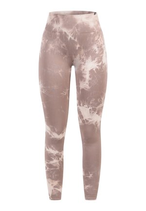Leggings de cintura alta en un patrón de tie-dye en marrón claro y crema, hechos de una tela suave y elástica con una silueta ajustada.