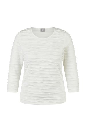 White long-sleeve shirt with a round neckline and horizontal textured ruffle details across the front, sleeves, and back.