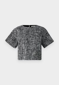 Top corto a maniche corte in tessuto texturizzato bianco e nero. Presenta un collo a giro e una zip invisibile sul retro.