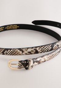 Snake-print leather belt in beige and brown tones with a gold buckle. Features a smooth texture and a slim, elegant shape.