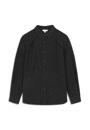 Camicia nera a bottoni con colletto strutturato, texture a coste e dettagli a pois bianchi sparsi. Dotata di maniche lunghe e design raglan.