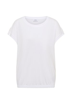 Blouse blanche à manches courtes avec col rond et manches retroussées ornées d'un détail bouton, ourlet élastiqué, étiquette "Cecil" à l'intérieur du col.