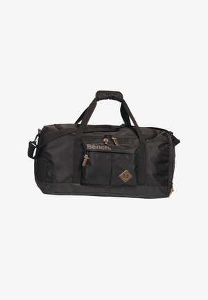 Black duffel bag made from durable nylon. Features dual handles, adjustable shoulder strap, zippered pockets, and a logo emblem.