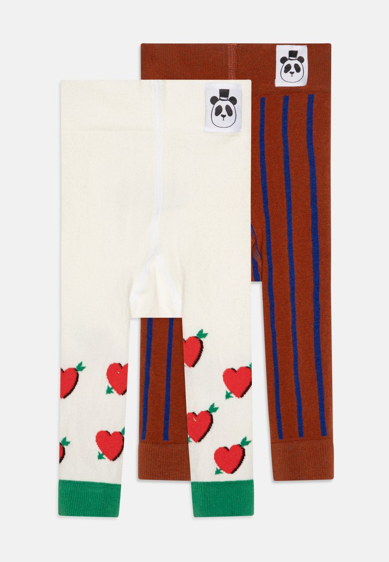 Kaksi paria lasten legginssejä: toiset valkoiset punaisilla sydämillä ja vihreillä yksityiskohdilla, toiset ruskeat sinisillä pystysuorilla raidoilla. Pandan logo vyötäröllä.