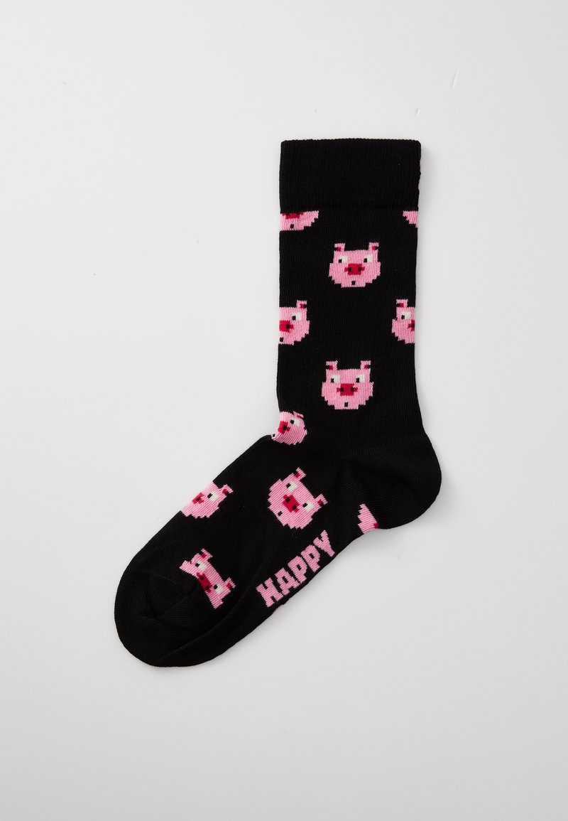 Svarta strumpor med ett upprepat mönster av rosa pixeliserade grisar, med ordet "HAPPY" i rosa text på botten. Mjuk textur.