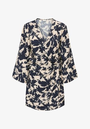 Robe portefeuille beige avec imprimé floral abstrait noir, manches longues amples, encolure en V et détail noué sur le côté.