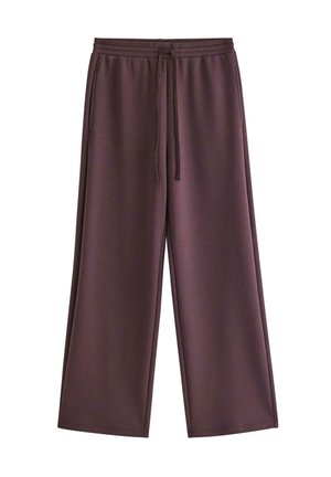 Close-up of a person wearing dark purple drawstring sweatpants with pockets, showing part of bare midriff and hands by sides.