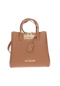 Borsa a tracolla in pelle color cuoio con manici doppi e etichetta rimovibile. Presenta accessori in oro e incisa il logo sul fondo. Chiusura superiore con cerniera.