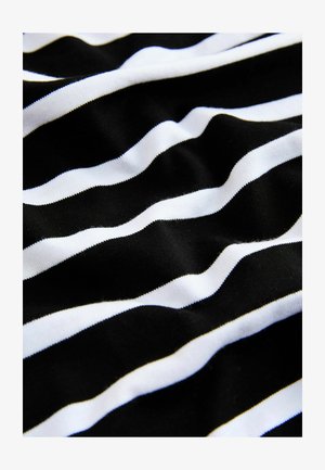 Tessuto a righe bianche e nere, dalla texture morbida, con schemi ondulati irregolari in colori alternati. Le righe orizzontali variano in larghezza.