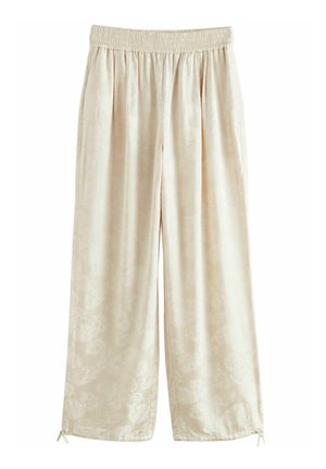 Roomkleurige wijde broek met elastische tailleband en een subtiel bloemmotief, met kleine strikjes aan de zoom.