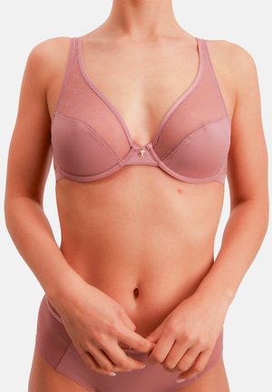BH aus weichem mauvefarbenem Stoff mit transparenter Spitzenüberlagerung, tiefem V-Ausschnitt und kleinem dekorativem Akzent in der Mitte. Mit breiten Trägern ausgestattet.