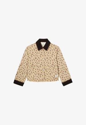 Veste florale beige avec col et poignets marron foncé, boutonnée à l'avant, manches longues, et poche plaquée sur le côté gauche.