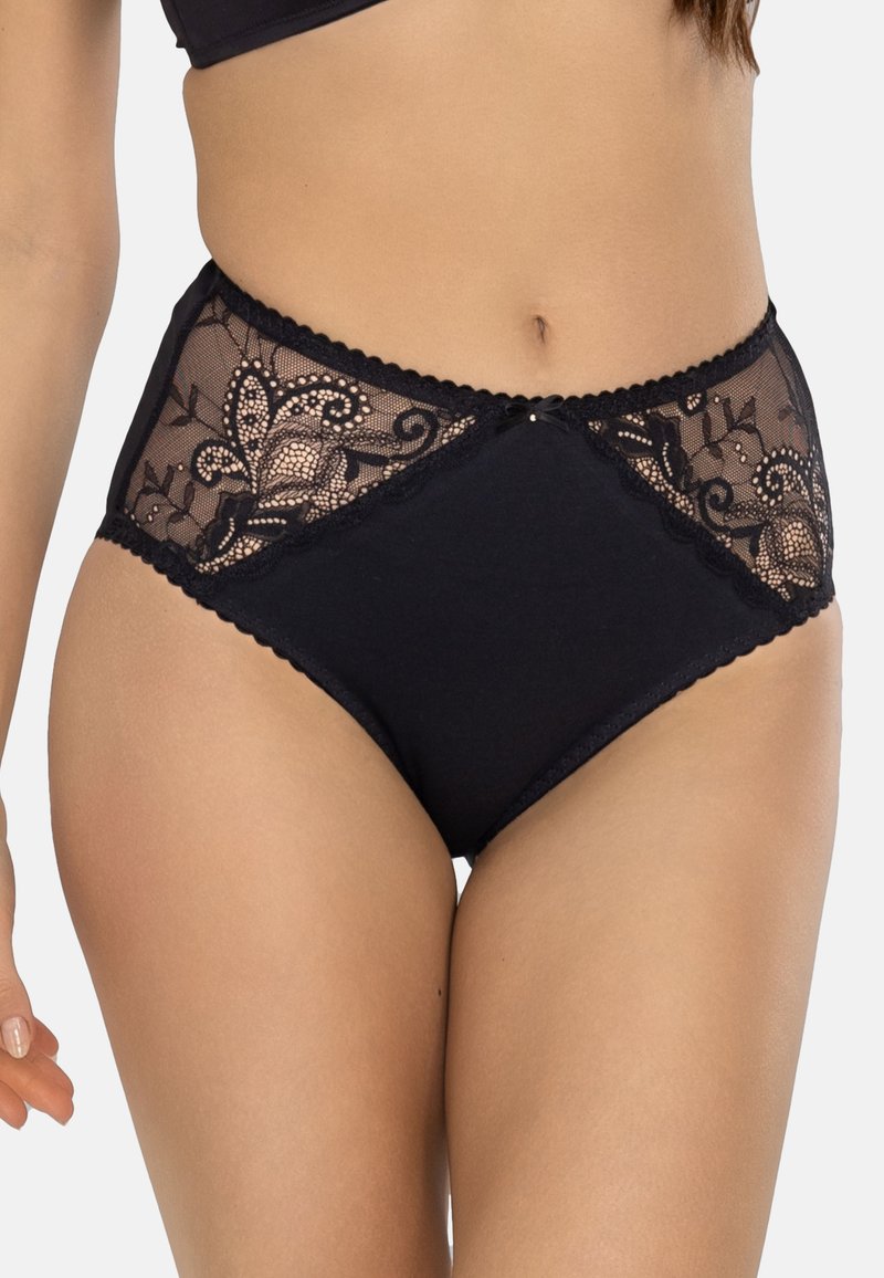 Pantaloni alti neri in vita con pannelli in pizzo a motivo floreale, bordi ondulati e un piccolo fiocco decorativo al centro frontale.