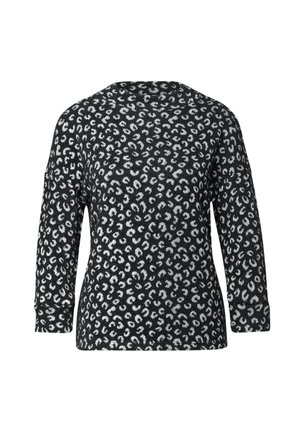 Top de estampado de leopardo en blanco y negro con mangas largas, cuello redondo y un corte holgado. Material de punto suave con acabado texturizado.