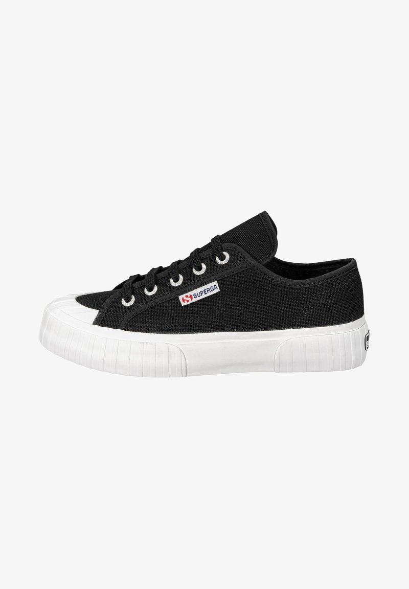 Black canvas sneaker with white rubber sole, featuring a rounded toe, lace-up design, and logo on the side. Classic low-top silhouette.
