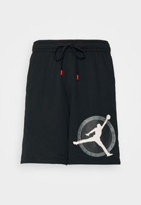 Svarta atletiska shorts i texturerad tyg, med en stor vit Jordan-logotyp med en cirkulär grå accent, samt dragsko i midjan.