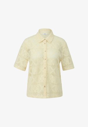 Cream-colored, short-sleeve crochet blouse with button-down front and pointed collar, featuring a geometric lace pattern.