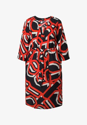 Polvipituinen mekko, jossa on rohkea punainen, valkoinen ja musta geometrinen kuvio. Mekossa on pitkät hihat, V-pääntie ja vyötäröllä vyö. Miellyttävä kangas.