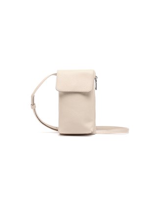 Small beige crossbody bag with a flap closure, side zipper, and adjustable strap on a white background.