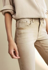 Next Jeans bootcut - beige tinted