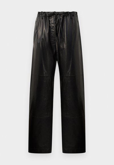 Black leather trousers with a relaxed fit, elastic waistband, and drawstring. Features a smooth texture and wide leg design.