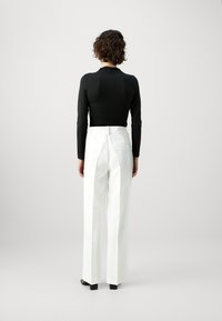 Modström GALE PANTS - Kelnės - soft white