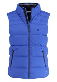 Blå pufferväst med hög krage, frontdragkedja och två sidofickor. Har sydda paneler och en liten logotyp på bröstet.