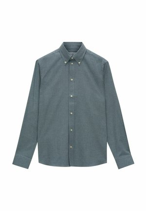 Chemise à boutons en tissu vert foncé, à manches longues, avec un col pointu et des boutons de couleur claire. Texture lisse avec une coupe ajustée.