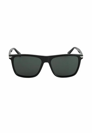 Melni taisnstūrveida saulesbrilles ar tumšiem tonētiem stikliem un smalkām sudraba detaļām uz briļļu kājiņām.