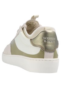 Scotch & Soda sneaker with a white mesh upper, olive green accents, beige suede toe, and a metallic gold heel cap. White rubber sole.