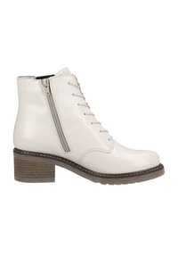 Bottines blanches en matériau brillant avec un zip sur le côté, un laçage à l'avant et un talon empilé marron. Présente des coutures contrastées.