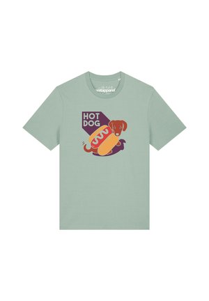 Light green t-shirt with a graphic of a brown dog inside a hot dog bun with mustard and text reading "HOT DOG."