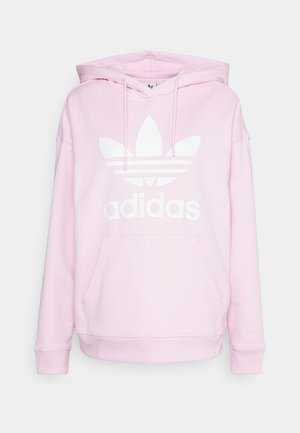 Rausvas medvilnės džemperis su kišene priekyje, su raišteliu reguliuojamu kapišonu ir dideliu baltu Adidas logotipu su trimis juostelėmis ir gėlėmis.