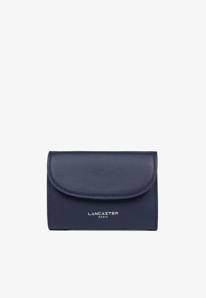 Navy leather wallet with textured surface, rounded flap closure, and white "LANCASTER PARIS" logo at the bottom. Compact and rectangular shape.