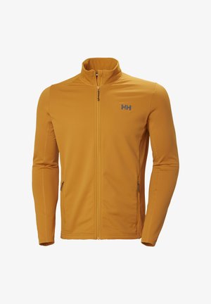 Chaqueta mostaza con cremallera completa, cuello alto, dos bolsillos laterales con cremallera y logo "HH" gris en el pecho izquierdo.