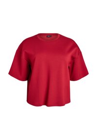 Červené oversized tričko s krátkym rukávom vyrobené z mäkkej tkaniny, s okrúhlym výstrihom a spustenými ramenami pre uvoľnený vzhľad.