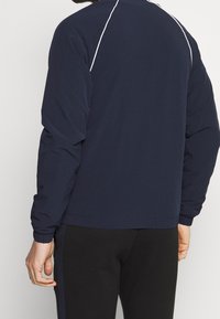 Lacoste Sport Bomber bunda - dark blue
