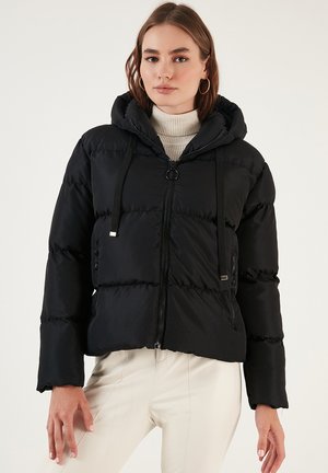 Black puffer jacket with a hood, featuring a front zipper, drawstring accents, and stitched panels. Soft, shiny material with a cropped fit.