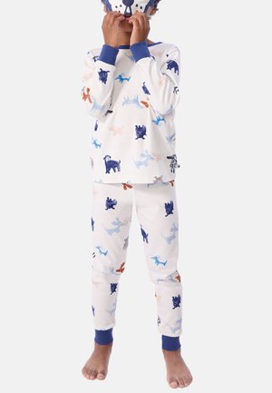 Ensemble de pyjama à manches longues avec un fond blanc orné de motifs de chiens colorés en bleu, orange et gris. Manches et ourlet côtelés bleus.