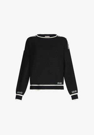Musthave mustra kootud sviiter valgete aktsentidega. Omab ümarat kaelust, pikki varrukaid ja bränditud detaile äärtes ja mansettides. Lukuga õlavarre detail.