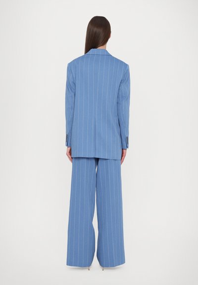 Blue pinstriped blazer and wide-leg trousers, made of smooth fabric, featuring a notched lapel and single back vent, with buttoned cuffs.