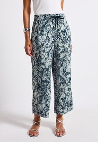 Wide-leg pants in snake print, featuring a drawstring waist, light fabric, and shades of blue and cream. Smooth texture with a casual fit.