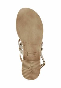 Beige sandal sole with textured grip, featuring a contoured shape, embossed logo, and a size label "37" on a smooth surface.