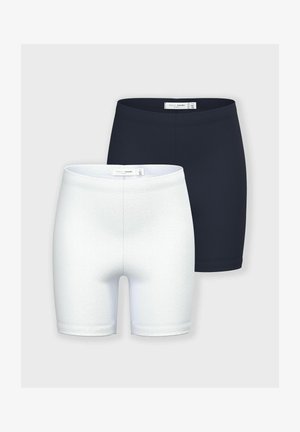 Dos pares de pantalones cortos básicos: uno en azul marino y el otro en blanco. Hechos de una tela suave, con un diseño ajustado y dobladillos sin costuras.
