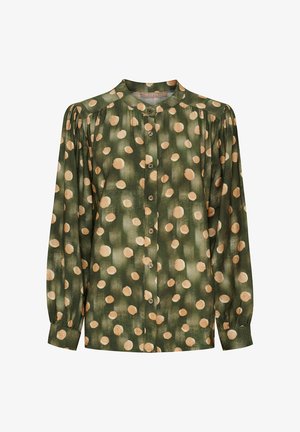 Grøn bluse med store beige prikker, knaplukning foran, plisserede skuldre og lange ærmer med manchetter. Blødt stof.