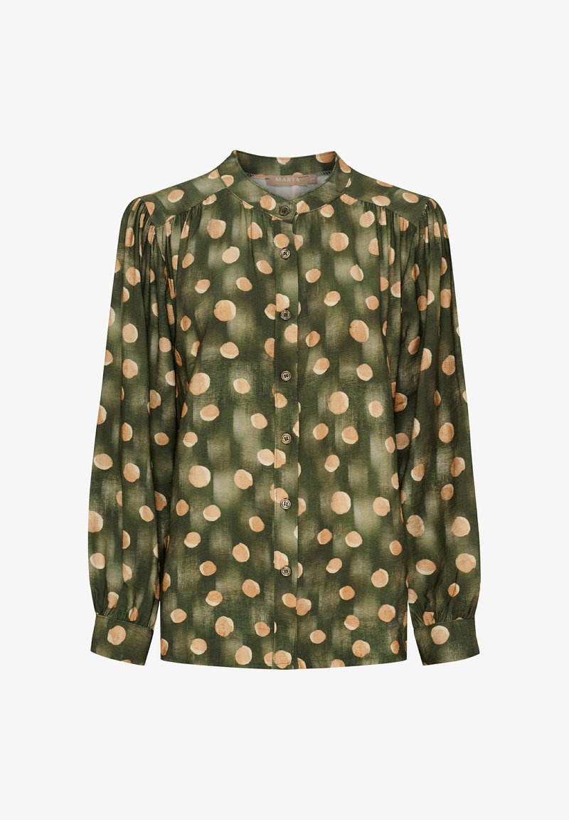 Grøn bluse med store beige prikker, knaplukning foran, plisserede skuldre og lange ærmer med manchetter. Blødt stof.
