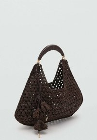 Brown woven handbag with an open crochet design, featuring a curved handle with leather wrapping and decorative tassels.